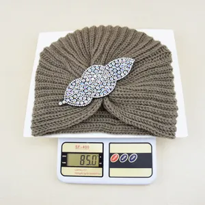 Brown knit turban hat with rhinestone leaf brooch, warm winter pullover hat for women.
