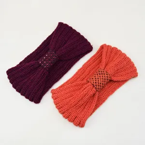 Close-up of knitted sequin bow headband, featuring soft ribbed texture for winter ear warmth.