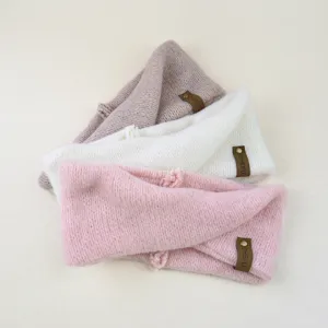 Mohair knit cross headband detail shot, cozy wide winter hair accessory in multi colors.