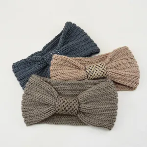 Knitted headband set with sequin bow detail, cozy ribbed ear warmer hair accessory for winter.