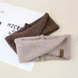 Knit mohair twist headband detail view showing soft texture, warm ear cover, and stylish design.