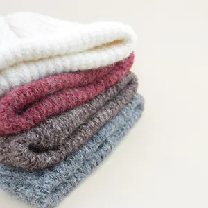 Chunky knit beanie detail, faux wool warm winter cap, cuffed ski cap, soft knit texture.