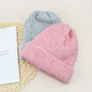 Cozy wool-blend winter beanie hat in solid pink and grey, thick cuffed knit for warmth.