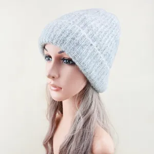 Grey knit beanie hat detail view, soft wool material and warm brim design for cold winter.
