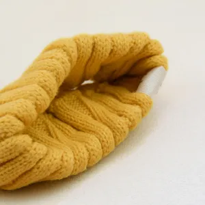Detail view of a yellow knitted headband, vintage wool hair accessory for yoga and daily wear.