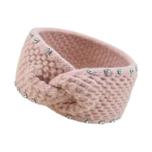 Nahaufnahme des pinken Strick-Haarbandes mit glitzernden Strasssteinen und Twist-Textur.