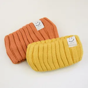 Vintage knitted hairband with smiley face label, soft wool headband for yoga and washing.