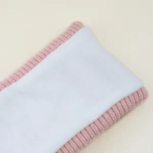 Pink knit fleece headband detail showing soft plush lining and sparkling silver wire.