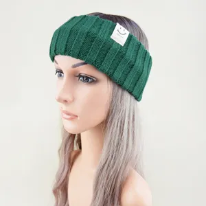 Dark green knitted headband detail, cozy winter ear warmer and stylish yoga hair accessory.