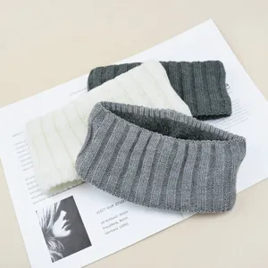 Detailed shot of thick ribbed fleece-lined knit headband winter ear warmer hair accessory.