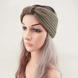 Detailed view of the knitted twist headband with delicate sequins, warm and stylish hair accessory.