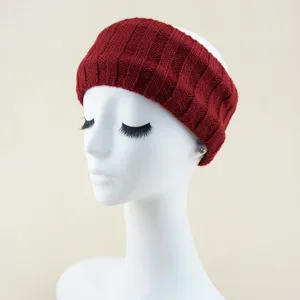 Detailed view of a dark red thick ribbed knit headband, stylish winter ear warmer hair accessory.