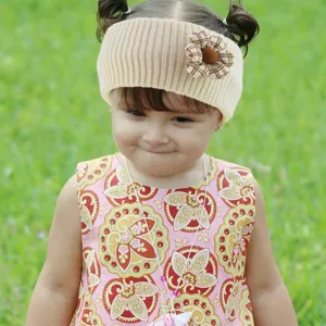 Kids beige knit headband detail showing cute plaid flower decoration and cozy ribbed texture.