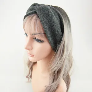 Dark grey knitted twist headband for women, wide elastic hair band for yoga, sports and daily wear.