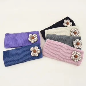Knitted flower headband detail showing colorful woolen hair accessories for daily wear.
