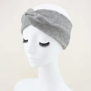 Grey knit twist headband detail shot, comfortable stretchy fabric for yoga and daily wear.