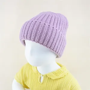 Kids chunky knit beanie detail shot, soft pastel purple winter warm hat close-up view.