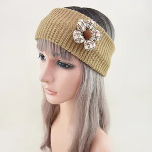 Knitted headband detail showing the khaki ribbed texture and plaid fabric flower decoration.