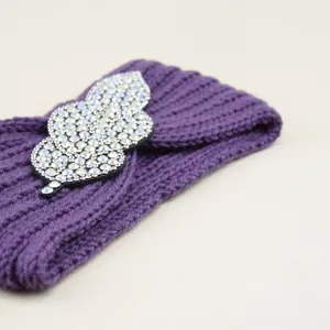Purple knit rhinestone leaf headband for women, stylish crystal hair accessory and warm ear cover.