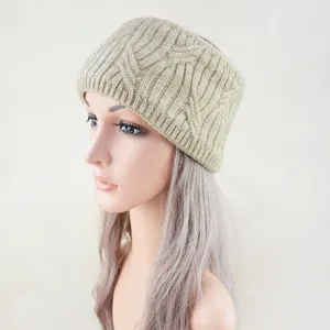 Detail of the knitted wide headband with metallic silver thread, cozy ear warmer winter accessory.