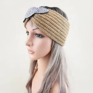 Knitted headband with rhinestone leaf detail, cozy winter hair accessory for women.