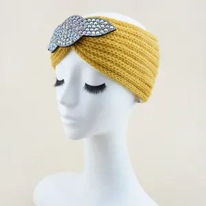 Yellow knitted headband with crystal leaf, cozy wool hair accessory for yoga and daily style.