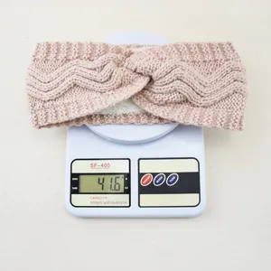 Pink knitted fleece lined headband winter warm ear warmer twist hair band detail view 41.6g