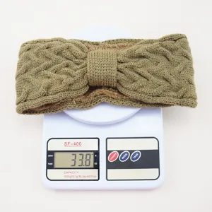 Detail shot of the thick knitted headband with fleece lining, weighing 33.8g on scale.