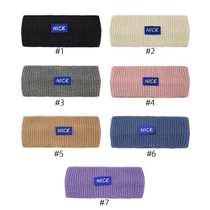 Knit headband with letter label, warm winter ear warmer and stylish sports hair accessory.