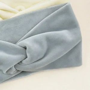 Soft plush twist headband detail view, cozy winter hair accessory for daily wear or washing face.