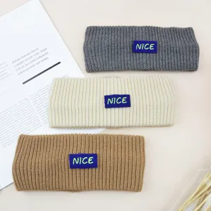 Cozy knit headband with letter patch, winter warm Y2K hair accessory for women daily wear.