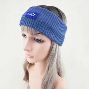 Blue knitted headband with nice letter label, warm woolen ear warmer for winter sports wear.