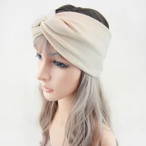 Detailed view of a soft plush twisted headband in beige, perfect for daily wear, yoga and washing.