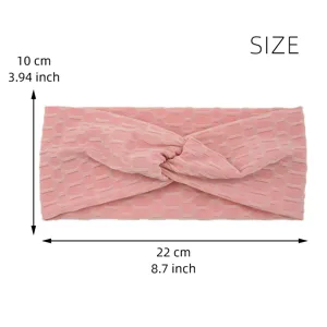 Detailed view of the pink yoga twist headband with mesh texture, dimensions 22x10cm.