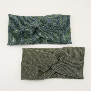 Detailed view of wide metallic cross hairbands, sparkly knitted elastic headbands for women.