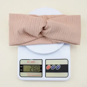 Nude pink ribbed twist headband, elastic yoga hair band for daily sports and face washing.