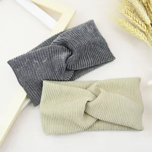 Detailed shot of sparkling metallic ribbed twist headbands, comfortable elastic hair accessories.