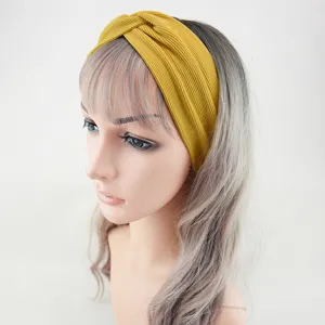 Yellow ribbed knotted headband for women, elastic wide hair band for daily yoga and sports.