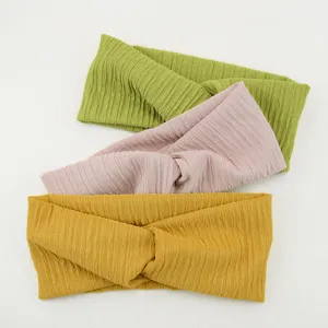 Set of 3 crinkled crisscross headbands in green pink and yellow for women sports yoga.