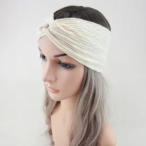 Beige twist headband for women, stretchy yoga and running hair accessory daily.