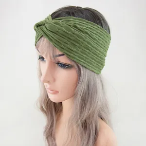 Green wide yoga headband with textured twist design, perfect for running, sports, and daily wear.