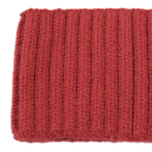 Detail shot of wide ribbed knit solid color headband, warm winter hair accessory for women.