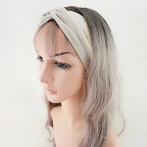 Detailed shot of ribbed twist headband, soft stretchy fabric, wide hair band accessory.