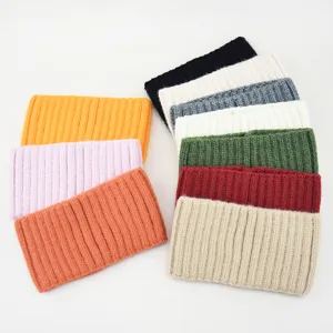 Detailed view of soft knitted headband, featuring clear rib texture and vibrant colors.
