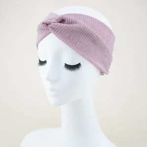 Pink glitter knotted headband for women, wide elastic hair band, stylish yoga hair accessory.