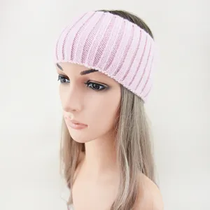 Detailed view of the pink knit headband, soft ribbed texture, wide elastic daily hair accessory.