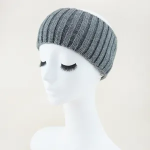 Grey knitted headband detail view, ribbed texture winter ear warmer head wrap accessory.