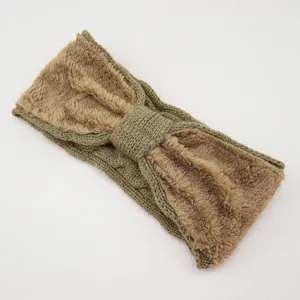 Close-up of the soft plush and knitted bow texture on the warm winter fleece headband.
