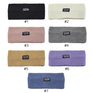 Detailed shot of knitted wide headbands in multi-colors, soft woolen yoga hair accessories.