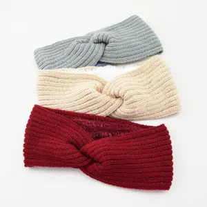 Detailed view of warm winter fleece lined knit headband with twist design for ear protection.
